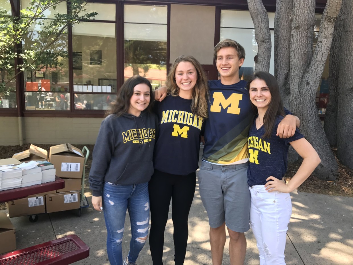 Students going to University of Michigan pose for a group photo. Left to right: Maddie Ebstein, Mackenzie Hazard, Chris Lobdell, and Lanie Van Linge.
